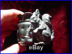 1800's Meriden # 54 toothpick holder Squirrel with glass eyes playing horn