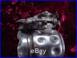 1800's Meriden #54 toothpick holder Squirrel with glass eyes playing horn