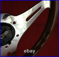 Classic wood rim, silver spokes 350mm steering wheel with Mazda horn button. 7B