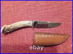 Custom made deer antler handle hunting knife with custom leather sheath