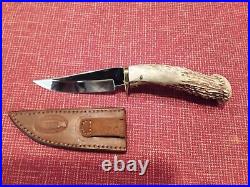 Custom made deer antler handle hunting knife with custom leather sheath
