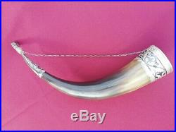 Drinking horn with silver decoration