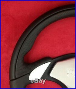 Genuine Momo X-Avion black leather 350mm steering wheel with silver horn pad