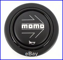 Genuine Momo car steering wheel horn push button. Black with silver arrow