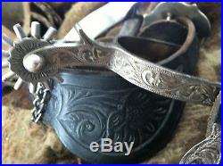 Used Ladies Fleming Sterling Silver Spurs and straps with Broken Horn Buckles
