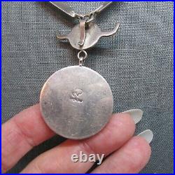 VINTAGE SOUTHWEST SPINY OYSTER NECKLACE WITH SOLID SIDES AND SUN FACE With HORNS